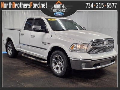 Photo of a 2014 RAM 1500 4X4 Laramie 4DR Quad Cab 6.3 FT. SB Pickup for sale