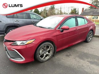 2021 Toyota Camry Hybrid with Ruby Flare Pearl Exterior