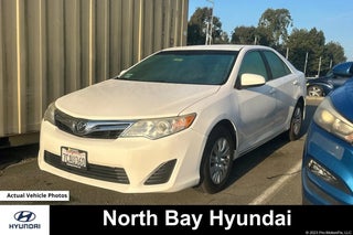 2014 Toyota Camry with Super White Exterior