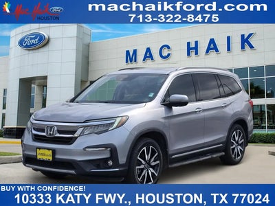 Photo of a 2021 Honda Pilot Touring 4DR SUV W/REAR Captain's Chairs for sale