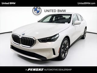 2026 BMW 5 Series with Mineral White Metallic Exterior